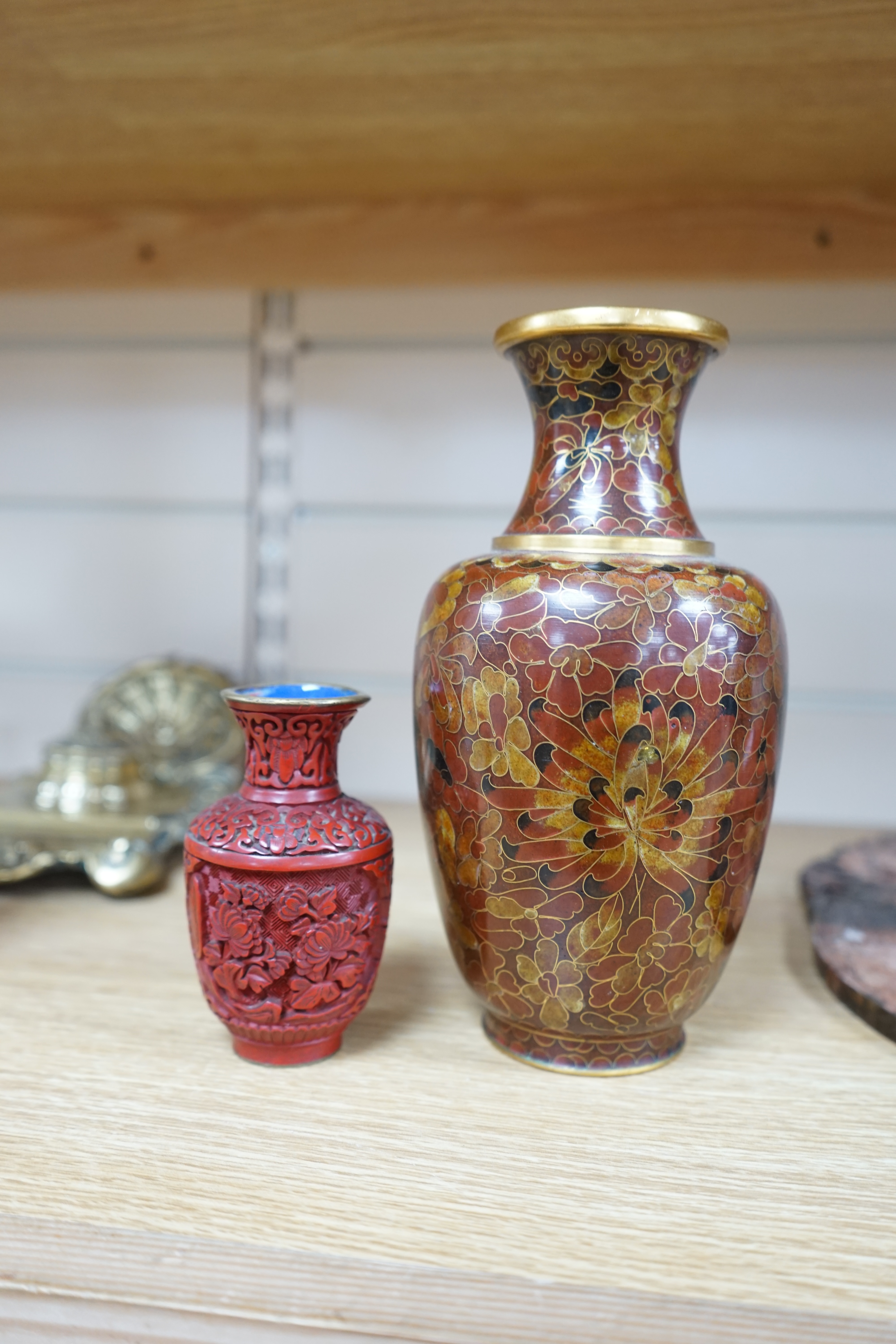 A Chinese archaistic hardstone large bi disc, a cinnabar lacquer vase and a cloisonné enamel vase, largest 32cm high (3). Condition - fair to good